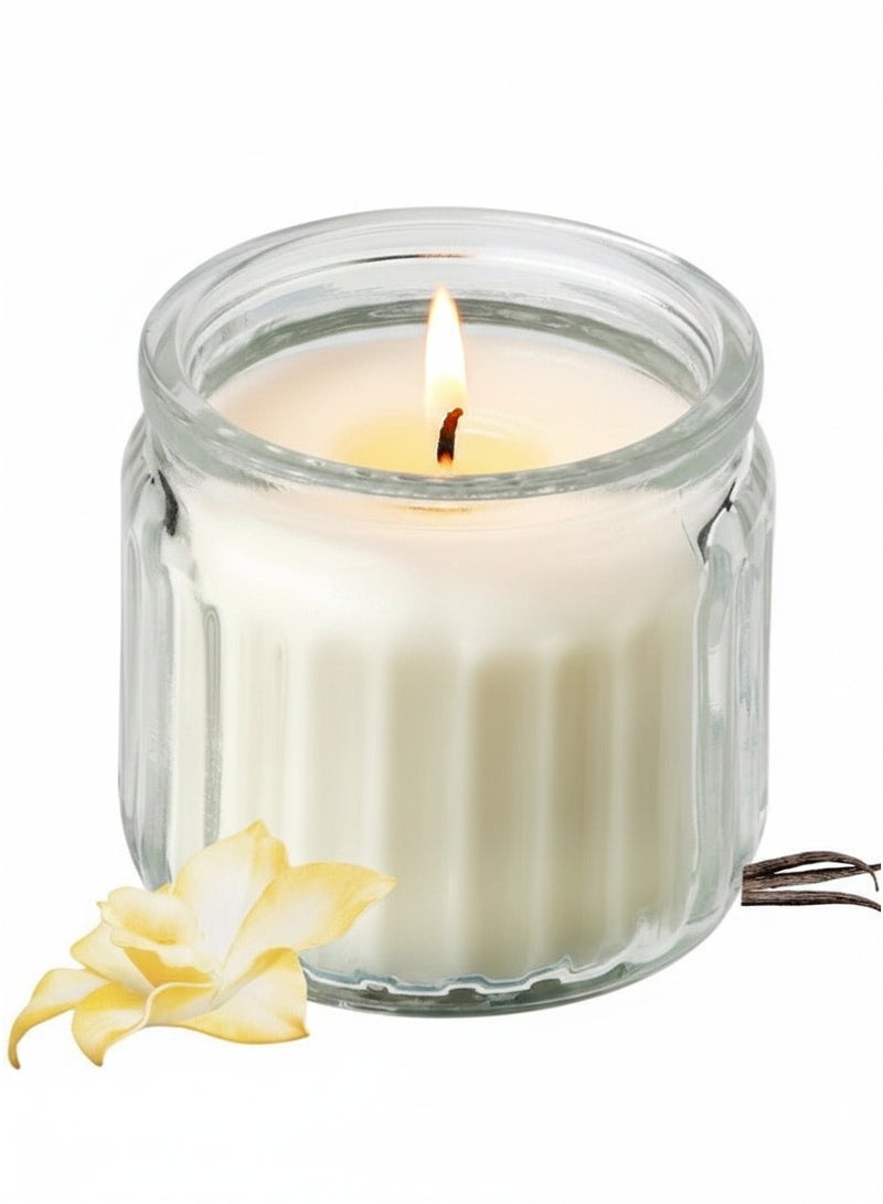 أيكيا شمعة معطرة برائحة الفانيليا الدافئة في وعاء زجاجي - شمعة ديكور بلون بيج دافئ لإضفاء جو مريح على المنزل، وهدية مثالية. - Image 1